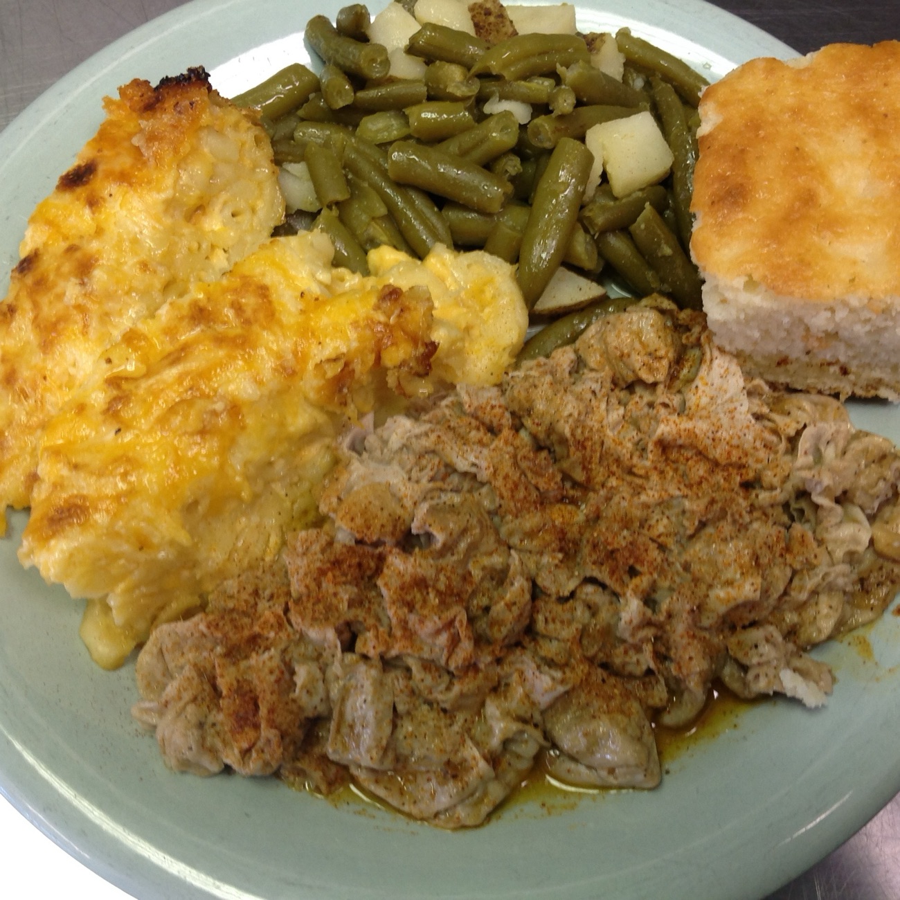 Chef Daddy's chitterlings plate with mac & cheese, green beans and cornbread
